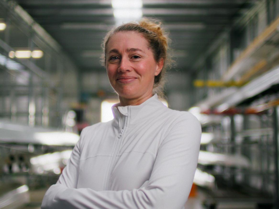 Dr Amber Halliday portrait in a rowing shed